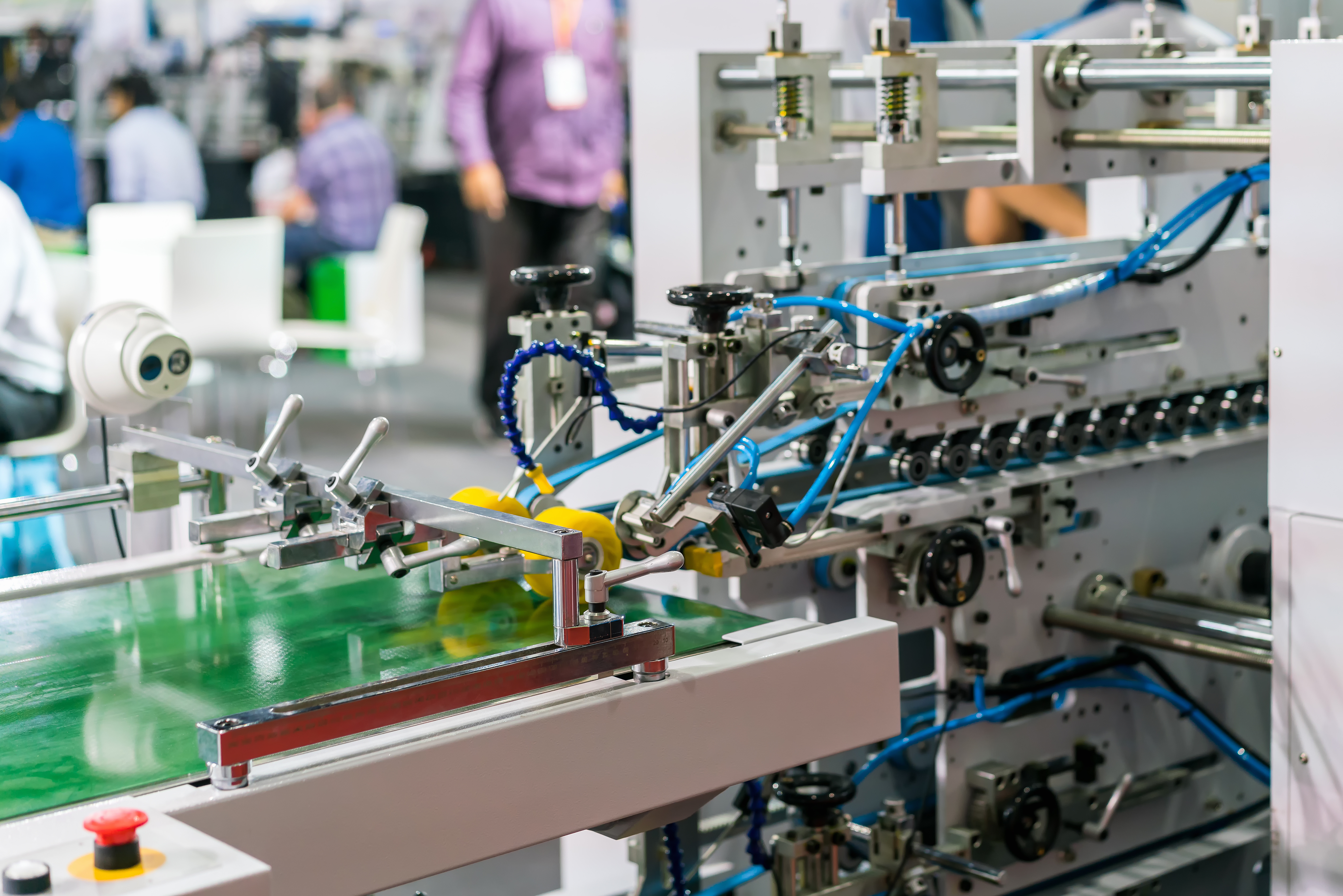Automated production equipment with connected material-handling systems